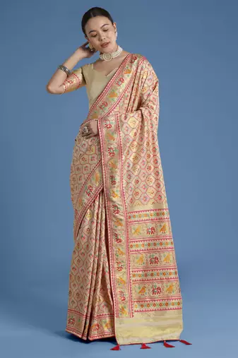 Cream banarasi silk blend jacuard work saree with unstitched blouse piece