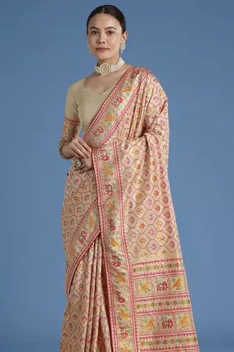 Cream banarasi silk blend jacuard work saree with unstitched blouse piece