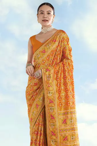 Yellow orange banarasi silk blend jacuard work saree with unstitched blouse piece