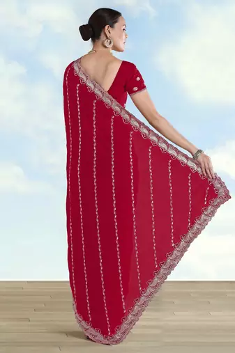 Rani pink georgette embroidery work saree with unstitched blouse piece