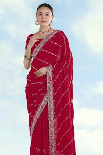 Rani pink georgette embroidery work saree with unstitched blouse piece