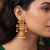 Traditional indian gold plated with green stones earrings