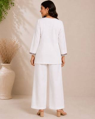 Women's daily wear stylish off-white embroidered cotton blend kurta with trouser set 3