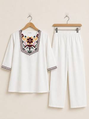 Women's daily wear stylish off-white embroidered cotton blend kurta with trouser set 4