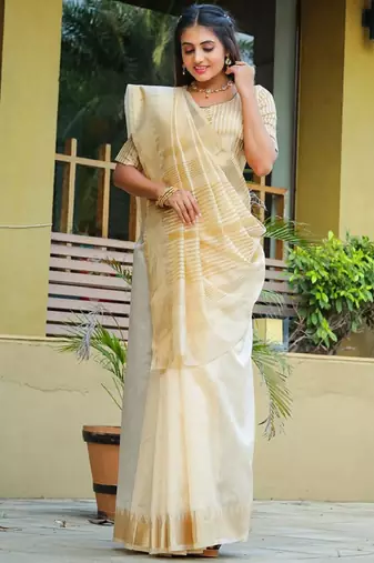 Cream ethnic motifs woven design zari silk cotton banarasi saree