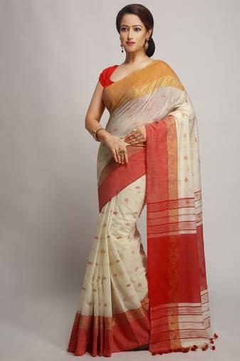 white zari work cotton saree with ethnic motifs