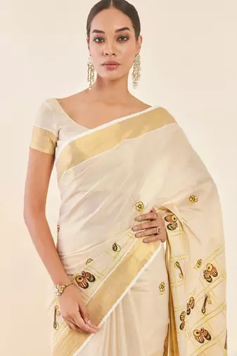 off white zari tissue kasavu saree with printed ethnic motifs