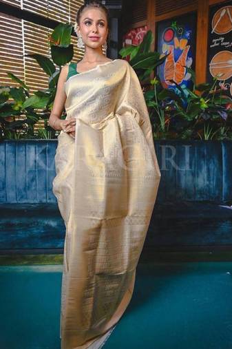 cream zari work silk kanjeevaram saree with ethnic motifs