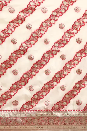 off white silk blend banarasi saree with heavy leheriya work