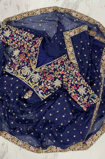 Navy blue organza sequin zari and thread embroidered saree with silk blouse