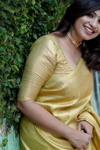 gold silk kanjeevaram saree with ethnic motif woven zari design