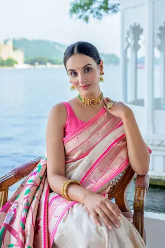 white ethnic motifs woven design zari silk blend kanjeevaram saree
