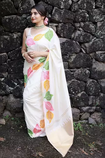 white banarasi silk saree with ethnic motifs zari design