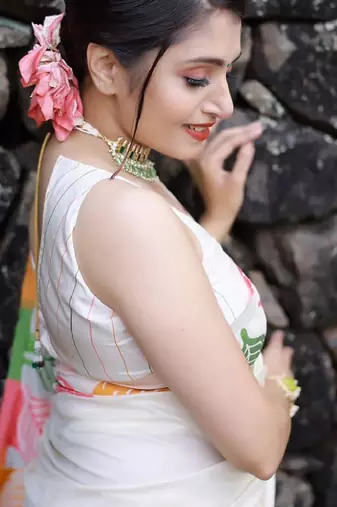 white banarasi silk saree with ethnic motifs zari design