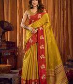 Mustard yellow soft tissue silk blend saree with red woven border