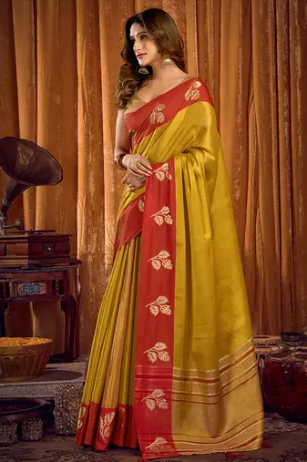 Mustard yellow soft tissue silk blend saree with red woven border