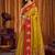 Mustard yellow soft tissue silk blend saree with red woven border