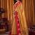 Beige gold soft tissue silk blend saree with rani pink zari woven border