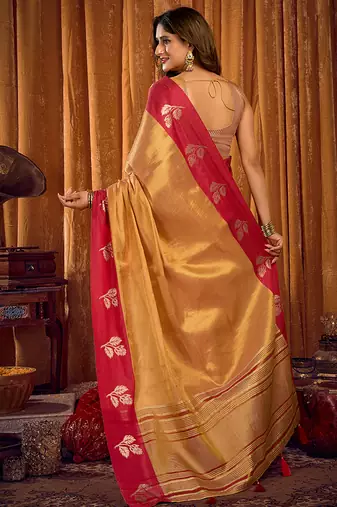 Beige gold soft tissue silk blend saree with rani pink zari woven border