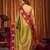 Olive green soft tissue silk blend saree with rani pink zari woven border