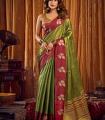 Green soft tissue silk blend saree with wine red zari woven border