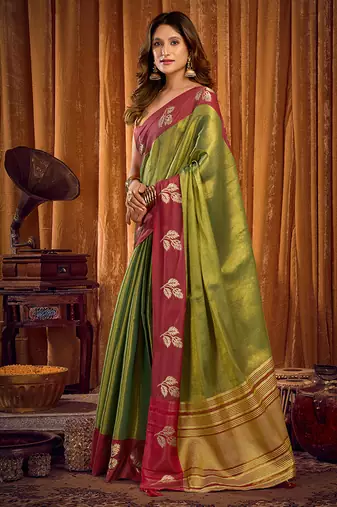 Green soft tissue silk blend saree with wine red zari woven border