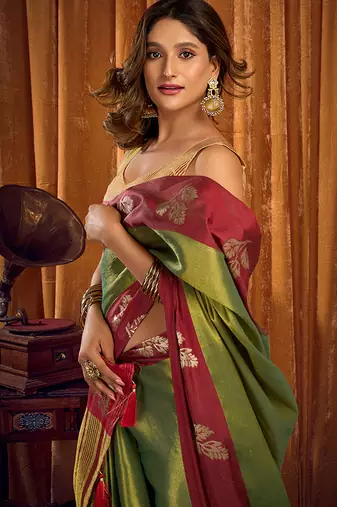 Green soft tissue silk blend saree with wine red zari woven border