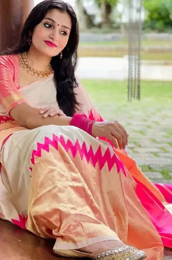 cream kanjeevaram saree with woven zari work