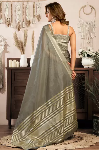 Grey khadi cotton saree with golden zari border and brocade blouse
