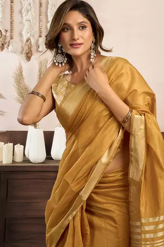 Mustard khadi cotton saree with golden zari border and brocade blouse