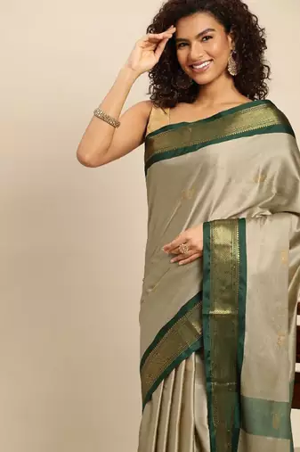 beige silk saree with woven zari design
