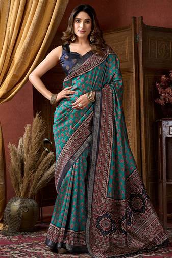 Teal faux crepe silk printed saree with blouse piece