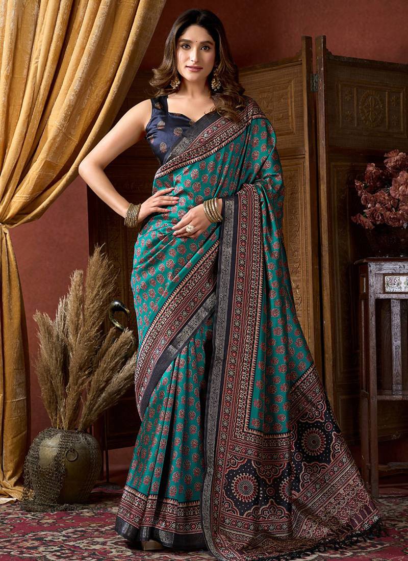 Teal faux crepe silk printed saree with blouse piece