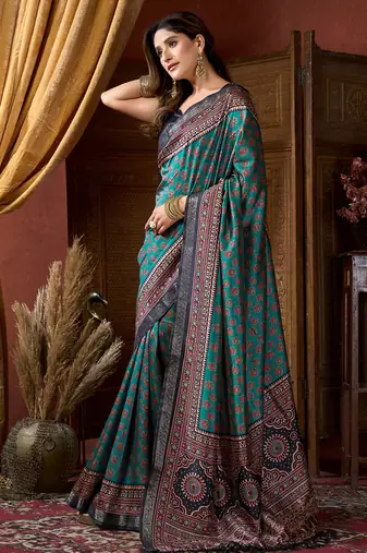 Teal faux crepe silk printed saree with blouse piece