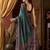 Teal faux crepe silk printed saree with blouse piece