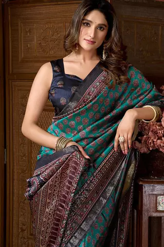 Teal faux crepe silk printed saree with blouse piece