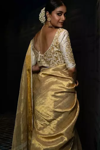 beige tissue saree with woven zari kanjeevaram design