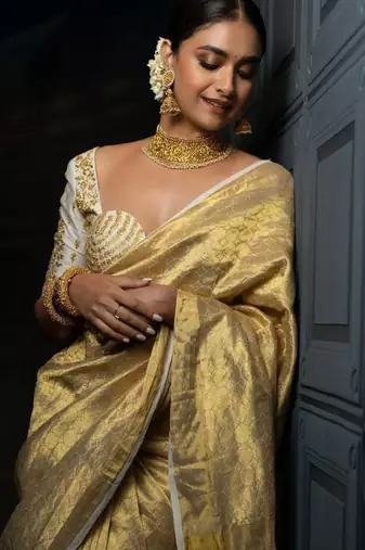 beige tissue saree with woven zari kanjeevaram design