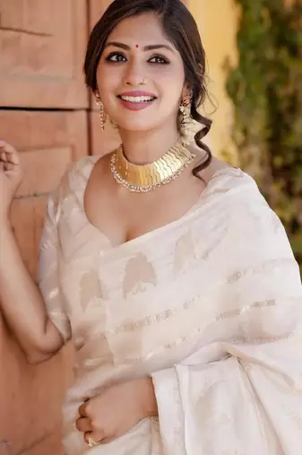 white saree with kanjeevaram woven zari pattern