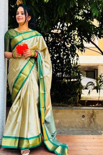 cream kanjeevaram saree with woven zari design