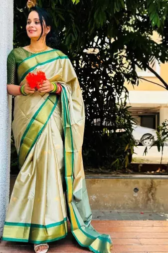 cream kanjeevaram saree with woven zari design