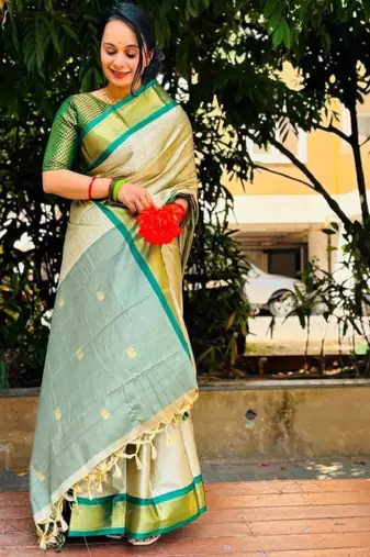 cream kanjeevaram saree with woven zari design