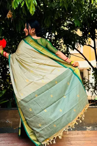 cream kanjeevaram saree with woven zari design