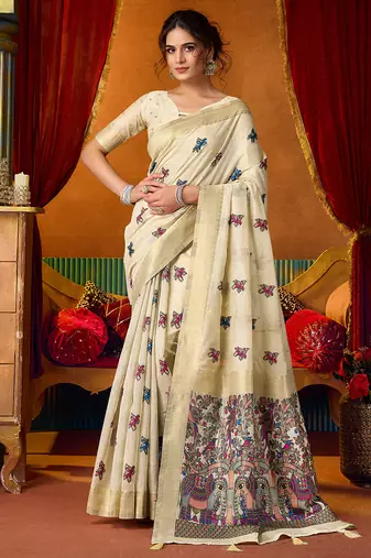 Cream cotton blend saree with traditional ethnic motifs and includes blouse piece