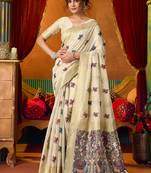 Cream cotton blend saree with traditional ethnic motifs and includes blouse piece