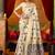 Cream cotton blend saree with traditional ethnic motifs and includes blouse piece