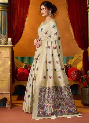 Cream cotton blend saree with traditional ethnic motifs and includes blouse piece 2