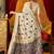 Cream cotton blend saree with traditional ethnic motifs and includes blouse piece