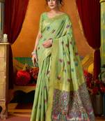 Light green cotton blend saree with traditional ethnic motifs and includes blouse piece