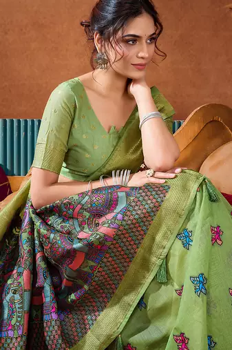 Light green cotton blend saree with traditional ethnic motifs and includes blouse piece